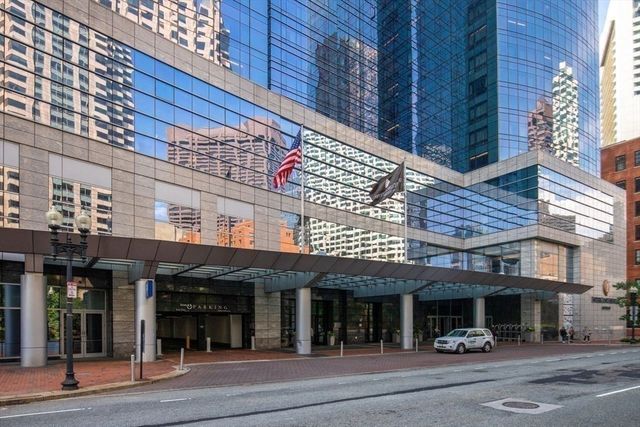 a bedroom with a bed and a mirror