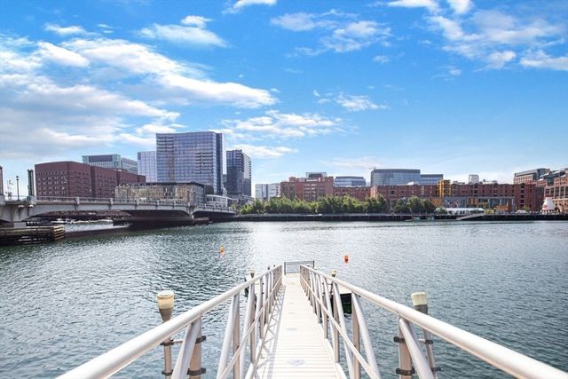 a view of a street with potted plants
