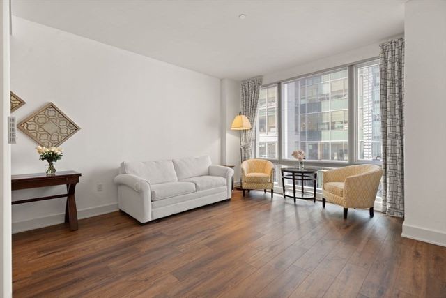 a room with cabinets and wooden floor