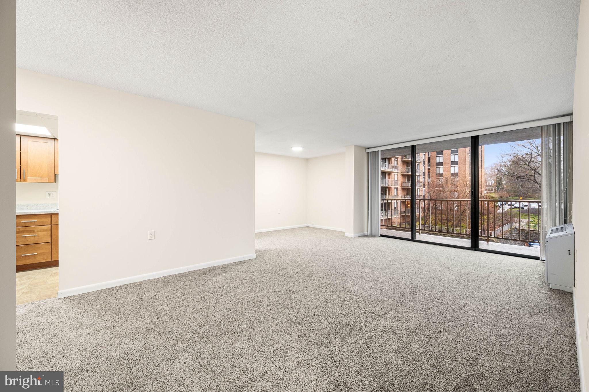 801 Yale Avenue, Unit 610 Swarthmore, PA 19081 - Photo 5 of 39 Living room and dining area with balcony view.