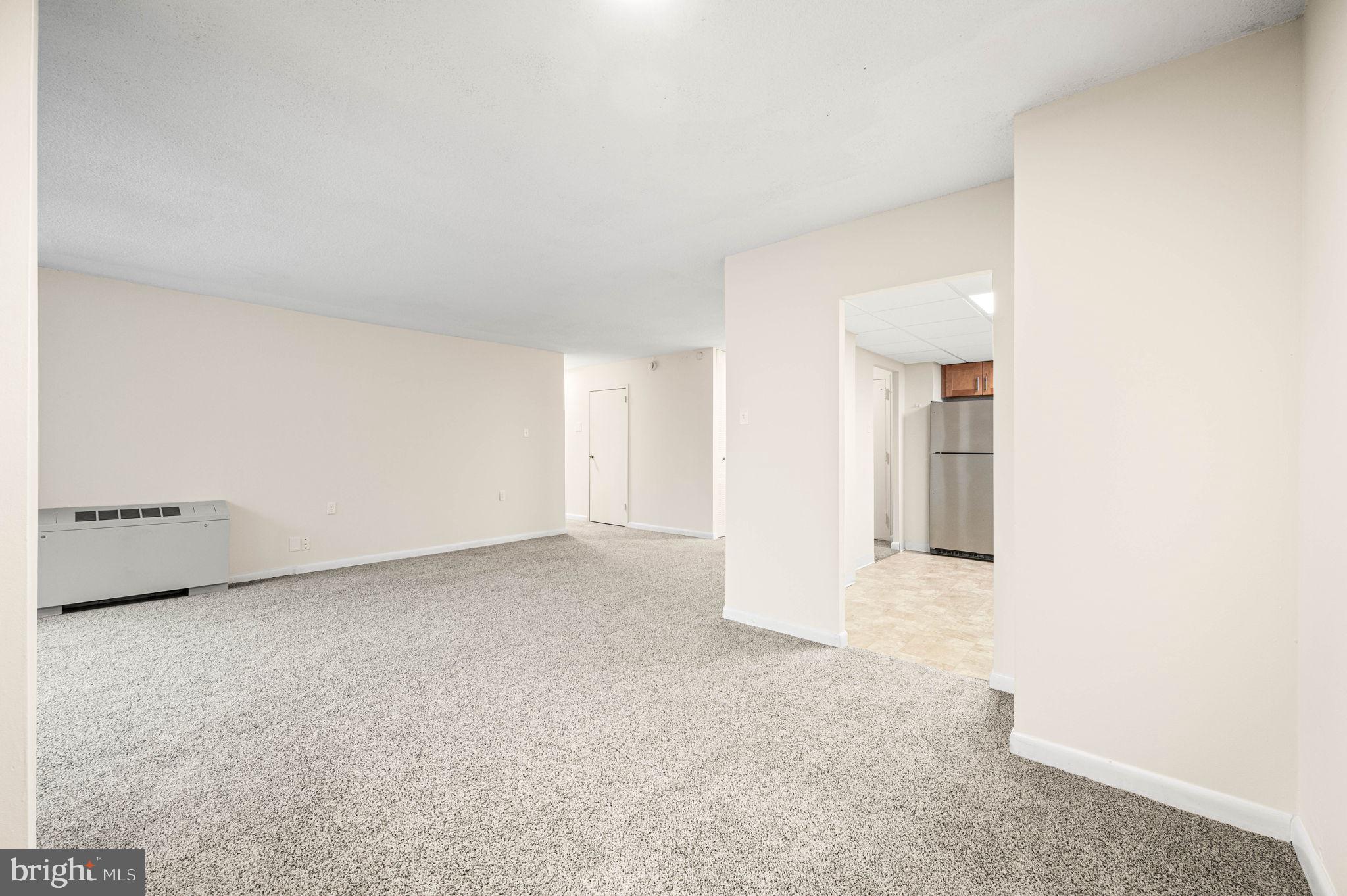 801 Yale Avenue, Unit 610 Swarthmore, PA 19081 - Photo 9 of 39 Dining are and living room looking into kitchen.