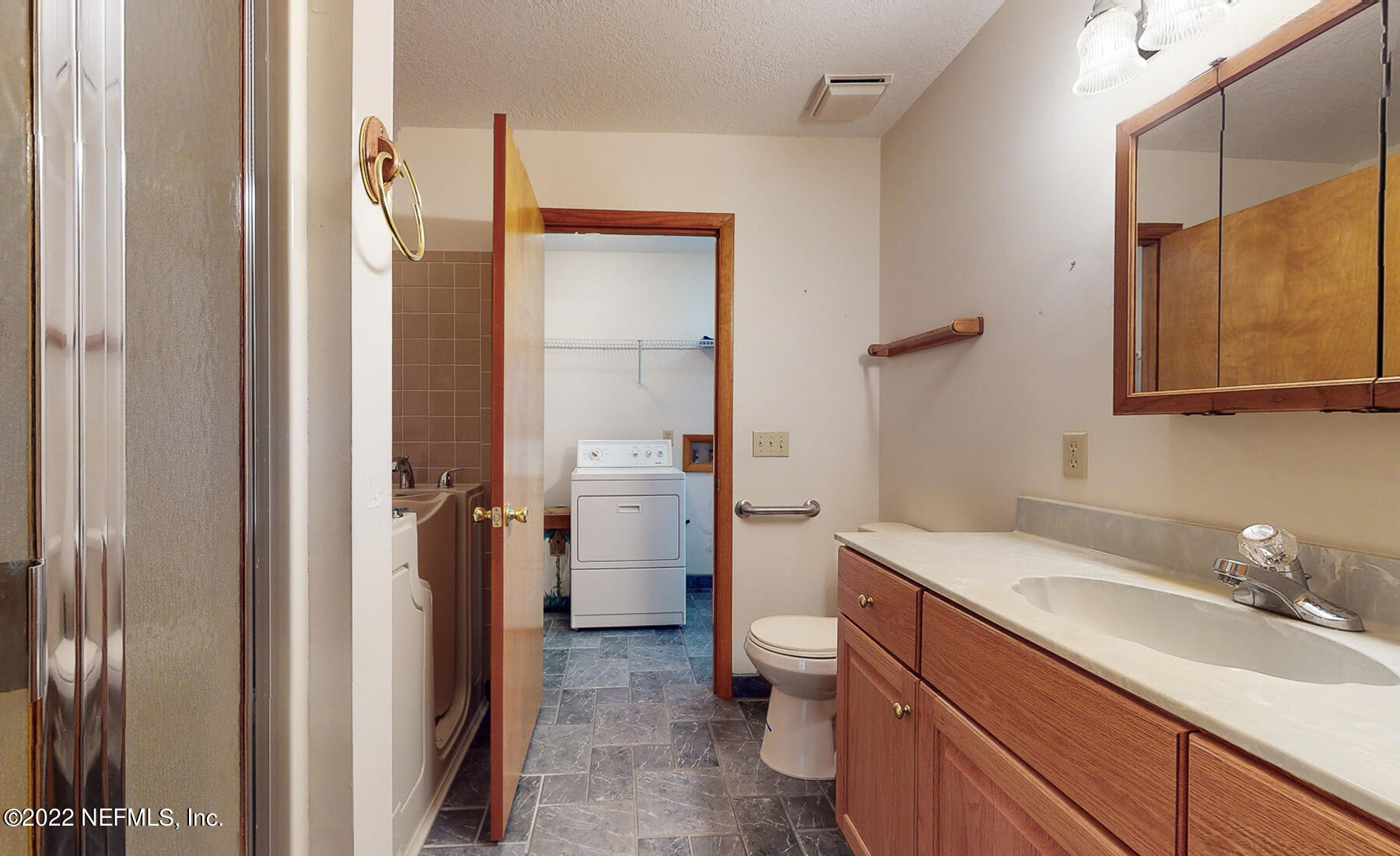 45918 Bismark Road Callahan, FL 32011 - Photo 21 of 45 a bathroom with a sink a toilet and shower