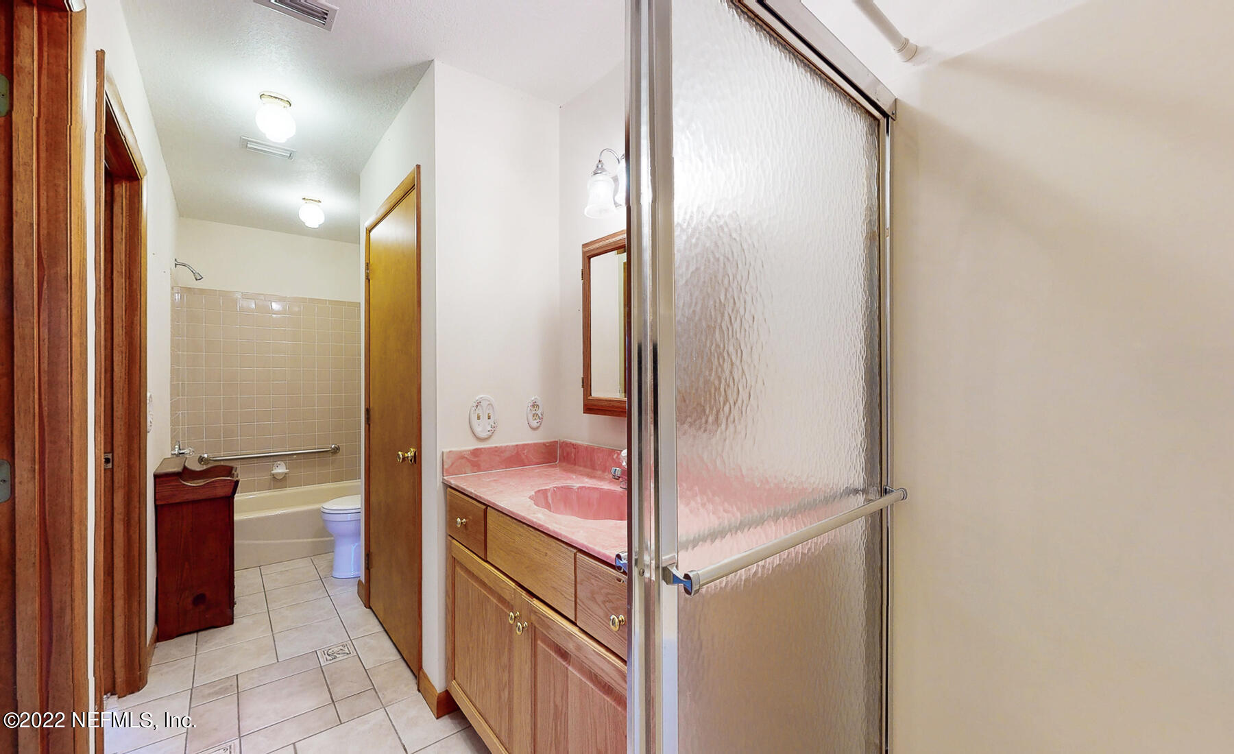 45918 Bismark Road Callahan, FL 32011 - Photo 24 of 45 a bathroom with a shower and a sink