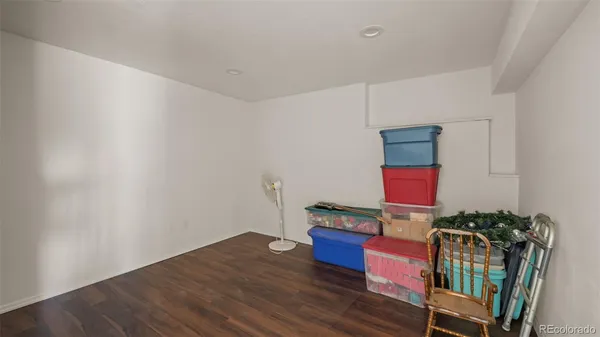 a room with furniture and wooden floor