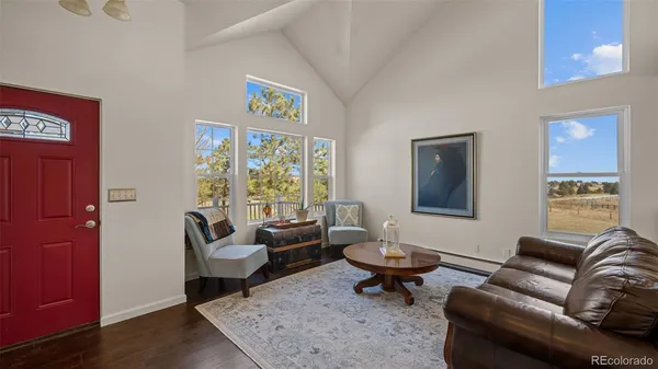 a living room with furniture and a rug