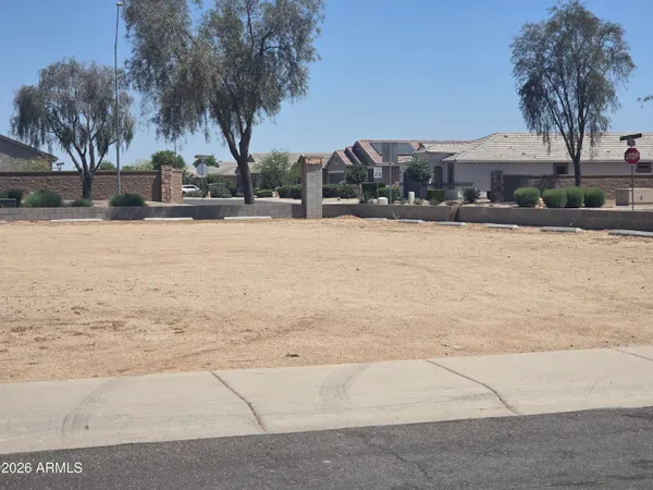 a front view of house with yard and lake view
