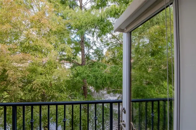a view of a forest from a balcony