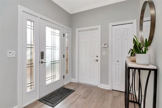 a view of kitchen with wooden floor and a potted plant