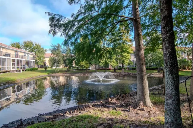 a view of lake with a yard