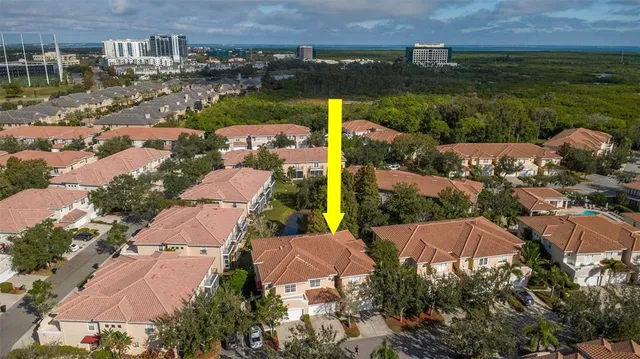an aerial view of a house with a lake view