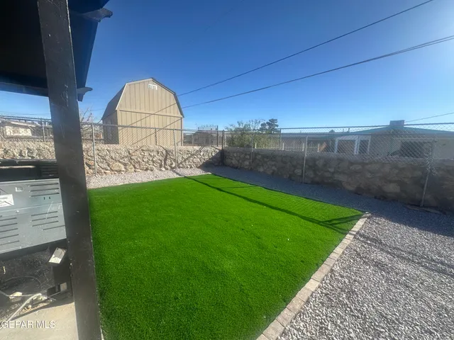 a view of a back yard of the house