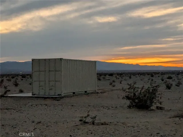 a view of a wooden fence with an outdoor space