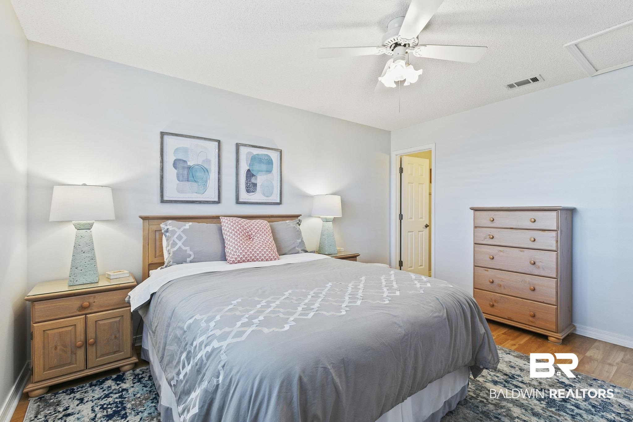 25861 Canal Road, Unit 78 Orange Beach, AL 36561 - Photo 24 of 45 Bedroom featuring ceiling fan, wood finished floors, visible vents, and baseboards