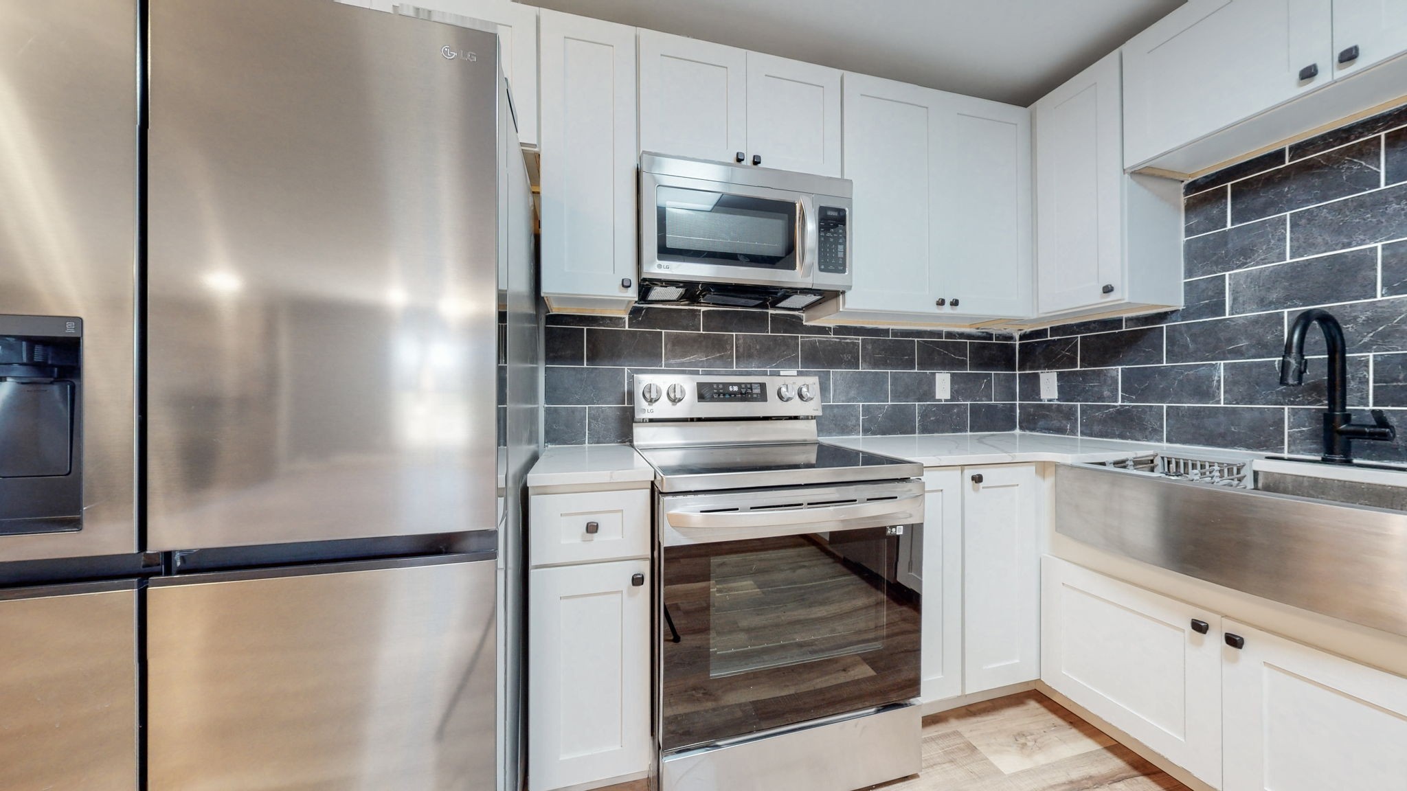 240 Myers Road Winchester, TN 37398 - Photo 14 of 46 a kitchen with a refrigerator and a sink
