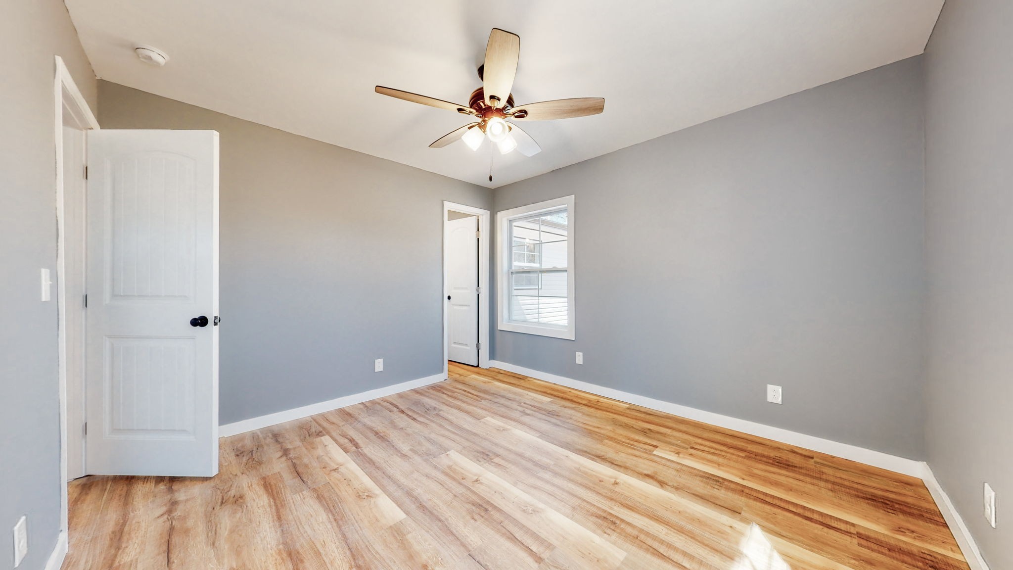 240 Myers Road Winchester, TN 37398 - Photo 21 of 46 a bedroom with a bed and a chandelier