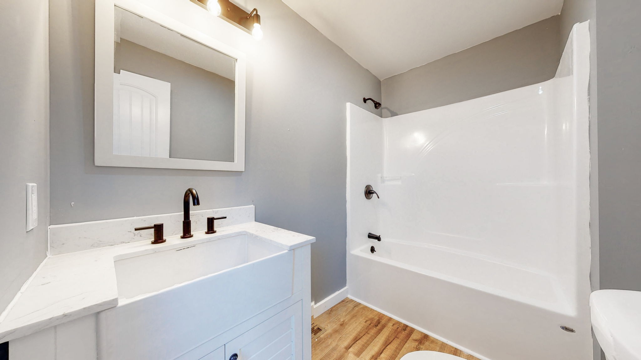 240 Myers Road Winchester, TN 37398 - Photo 23 of 46 a bathroom with a bathtub a sink a toilet and a mirror