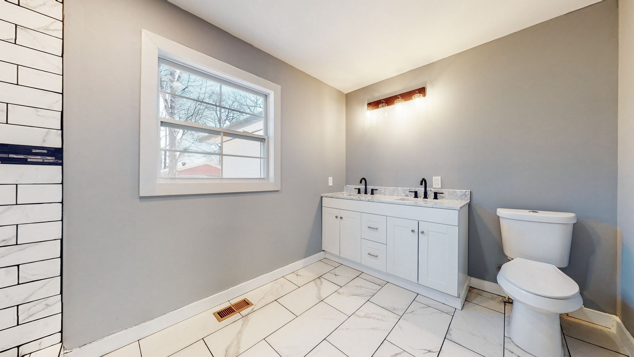 240 Myers Road Winchester, TN 37398 - Photo 27 of 46 a bathroom with a toilet sink and mirror