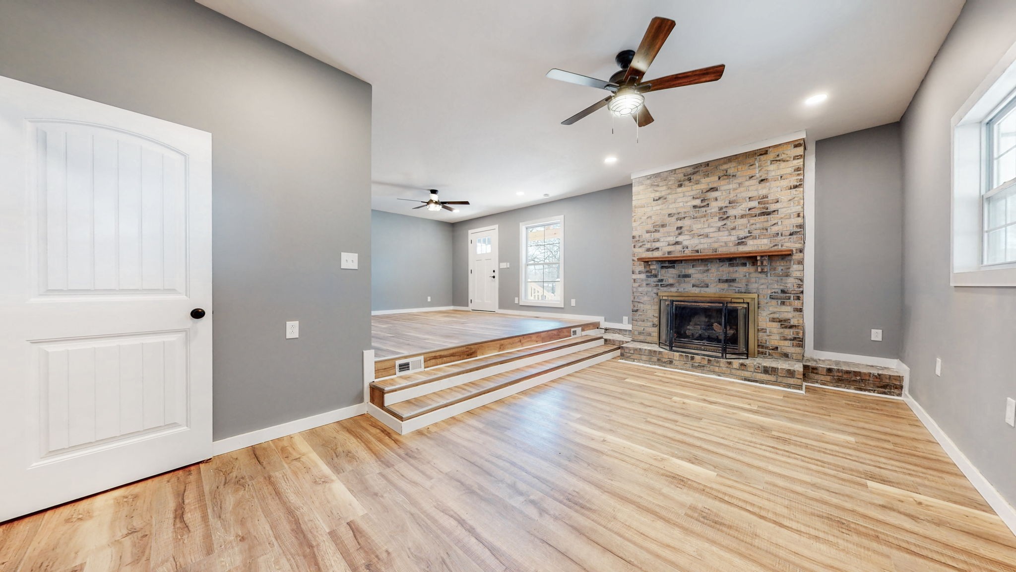 240 Myers Road Winchester, TN 37398 - Photo 10 of 46 a living room with furniture a fireplace and a ceiling fan