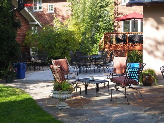 227 Addison Road Riverside, IL 60546 - Photo 20 of 21 a view of a patio with table and chairs and potted plants