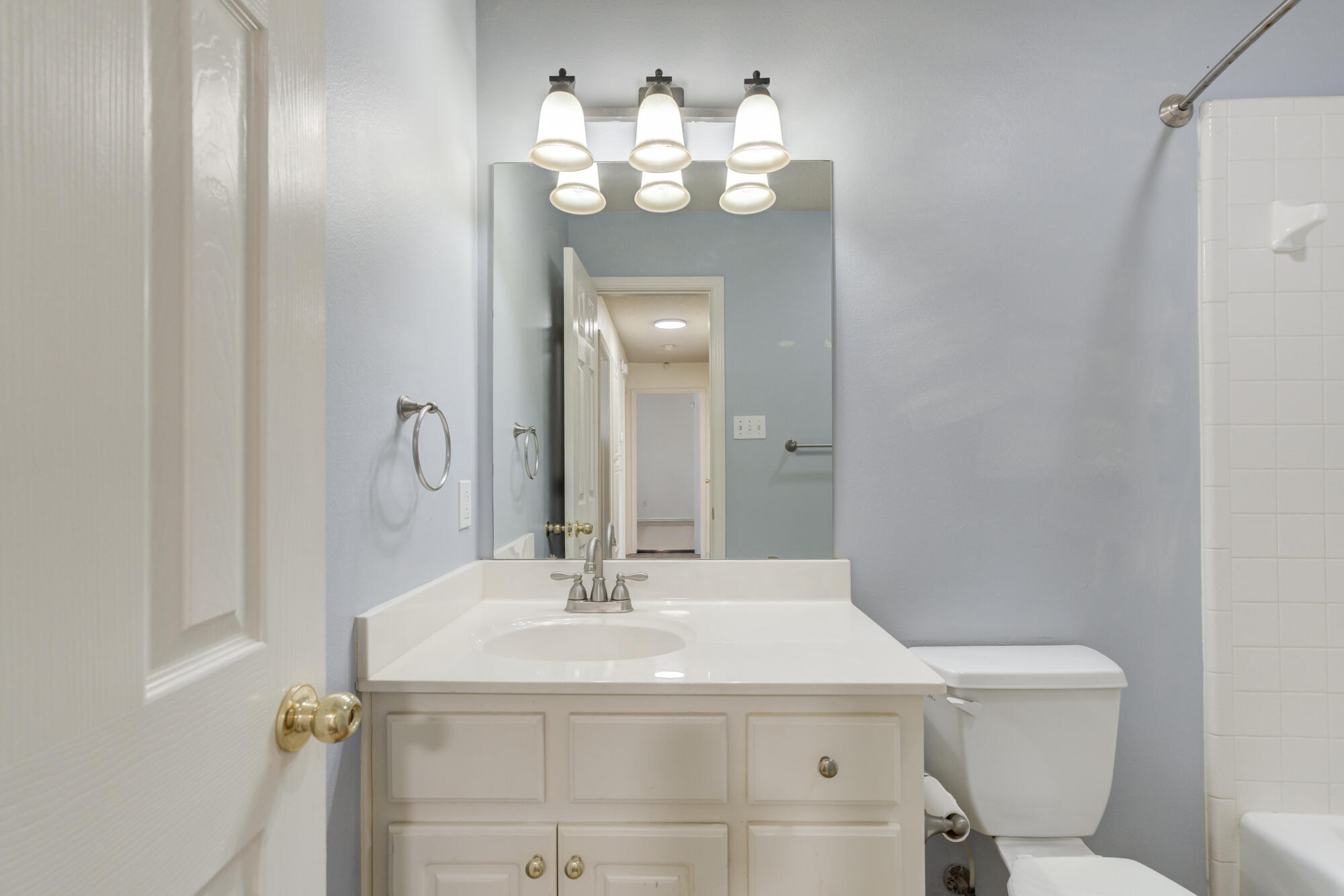 1903 77th Street Lubbock, TX 79423 - Photo 22 of 30 a bathroom with a sink and a mirror