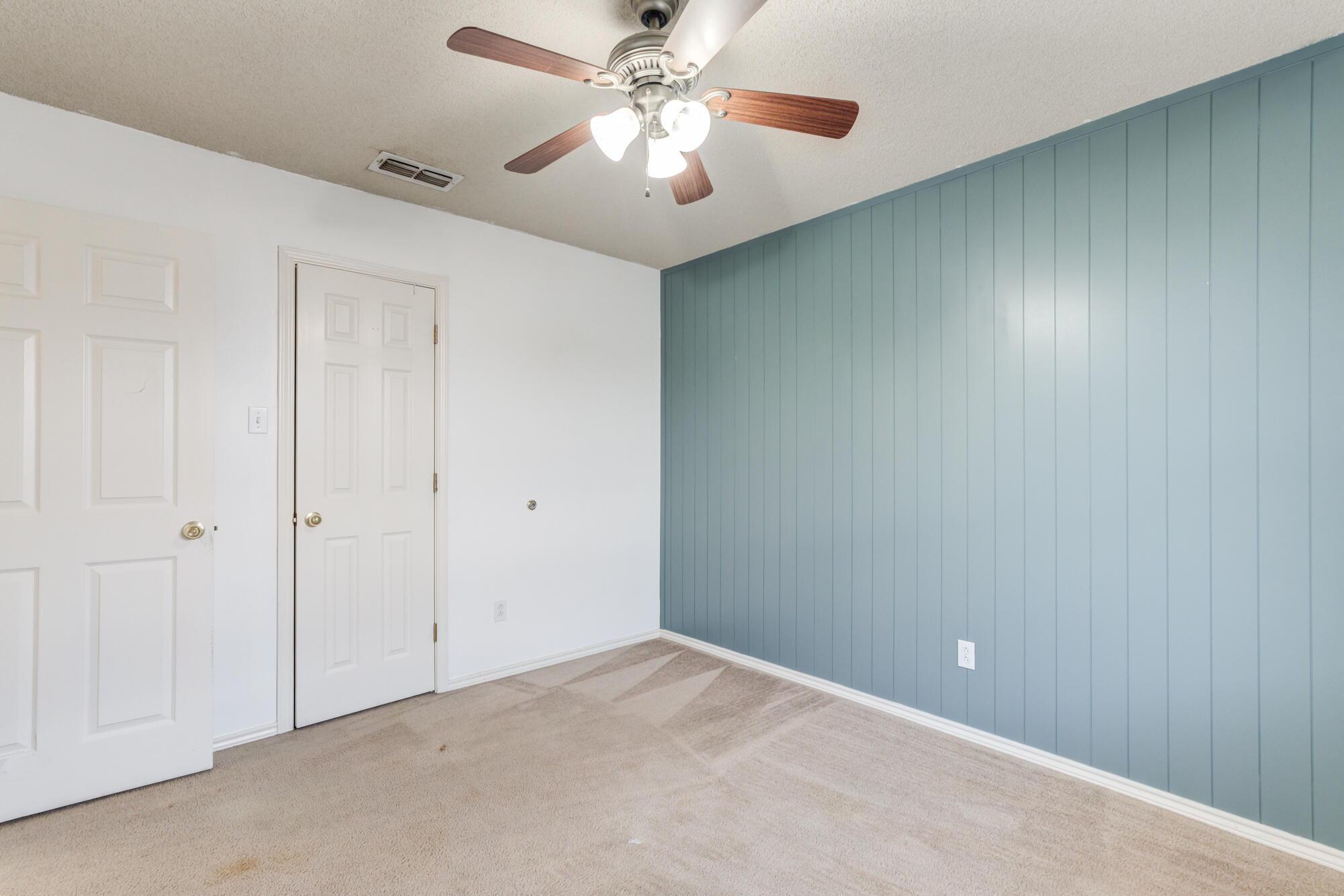 1903 77th Street Lubbock, TX 79423 - Photo 24 of 30 a view of a room with a ceiling fan and a fan