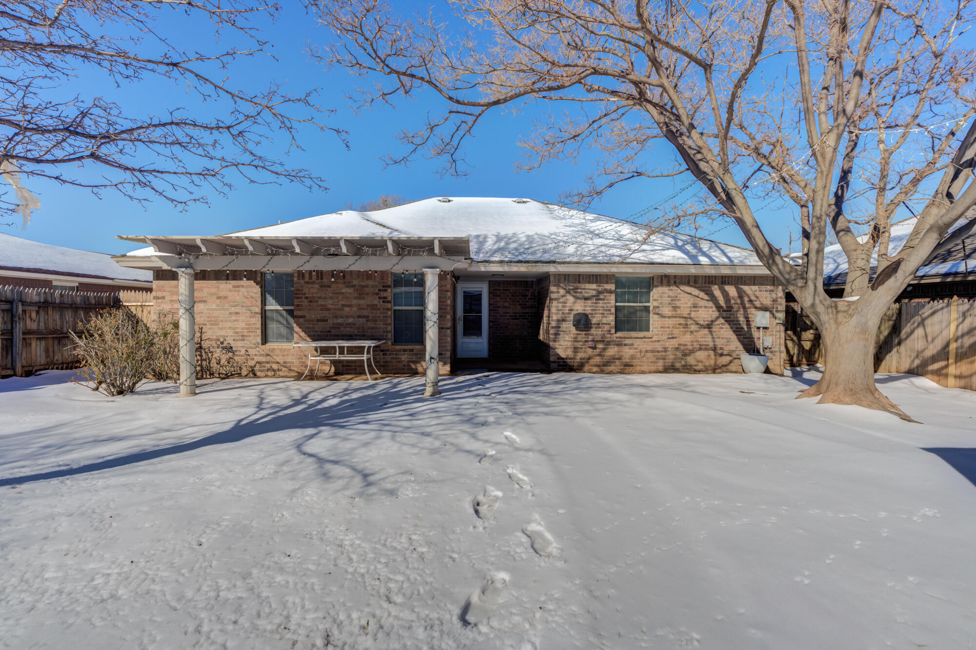 1903 77th Street Lubbock, TX 79423 - Photo 29 of 30 a view of a house with a patio and a yard