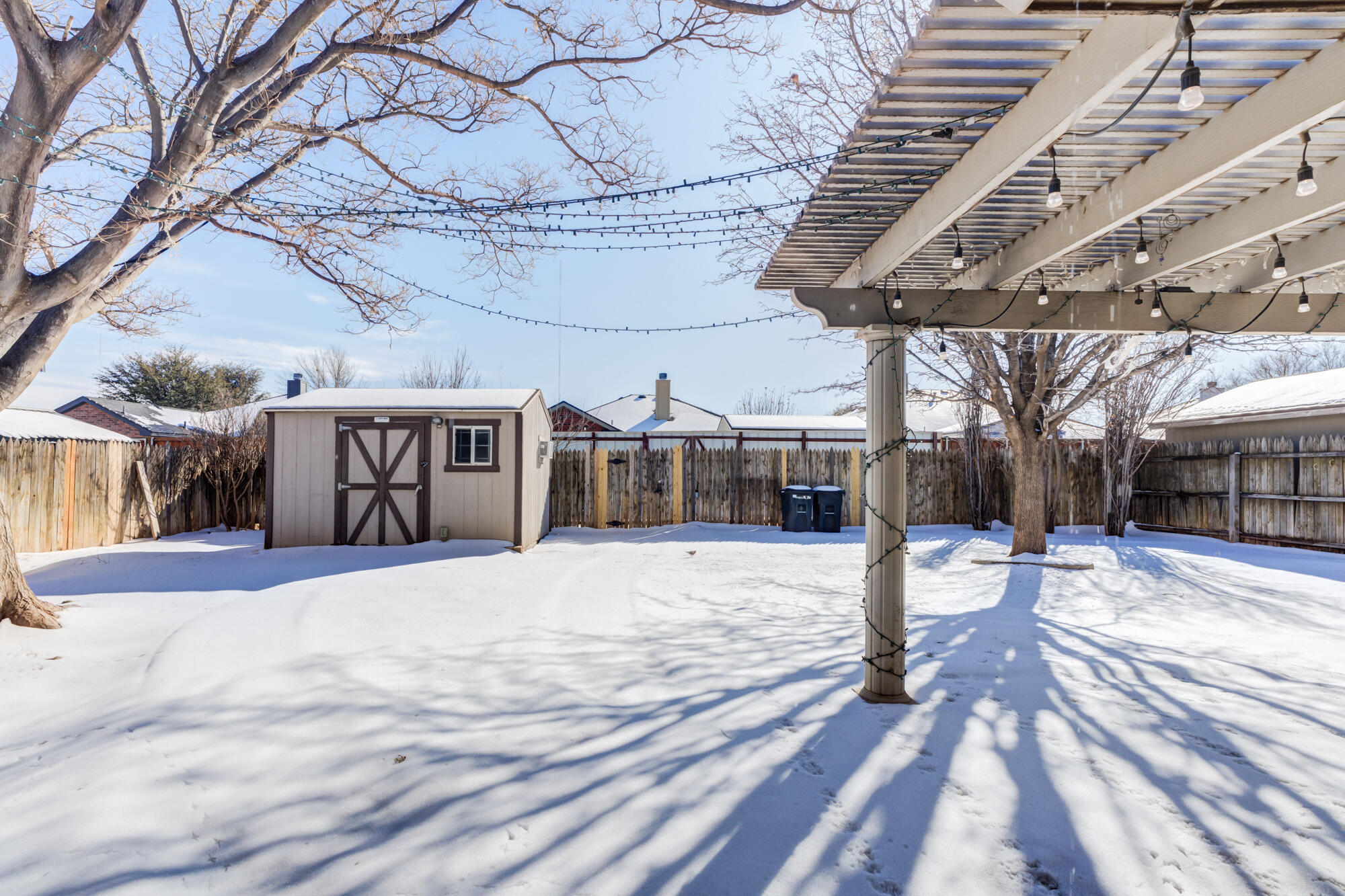 1903 77th Street Lubbock, TX 79423 - Photo 5 of 30 a view of a backyard of a house