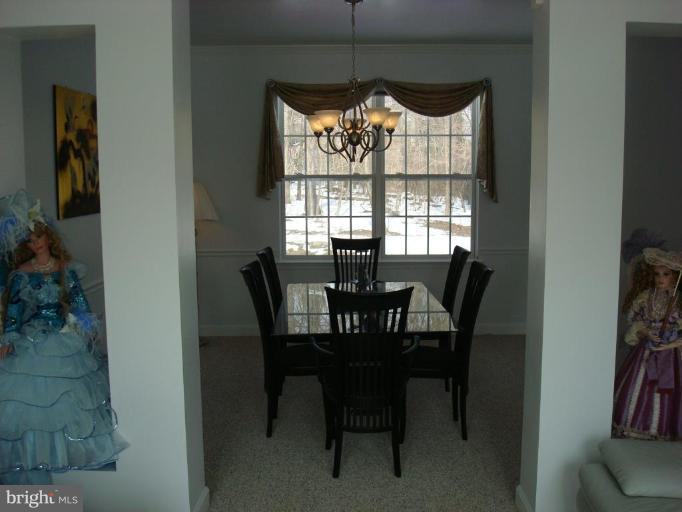 18810 Severn Road Gaithersburg, MD 20879 - Photo 5 of 28 a view of a dining room with furniture window and outside view
