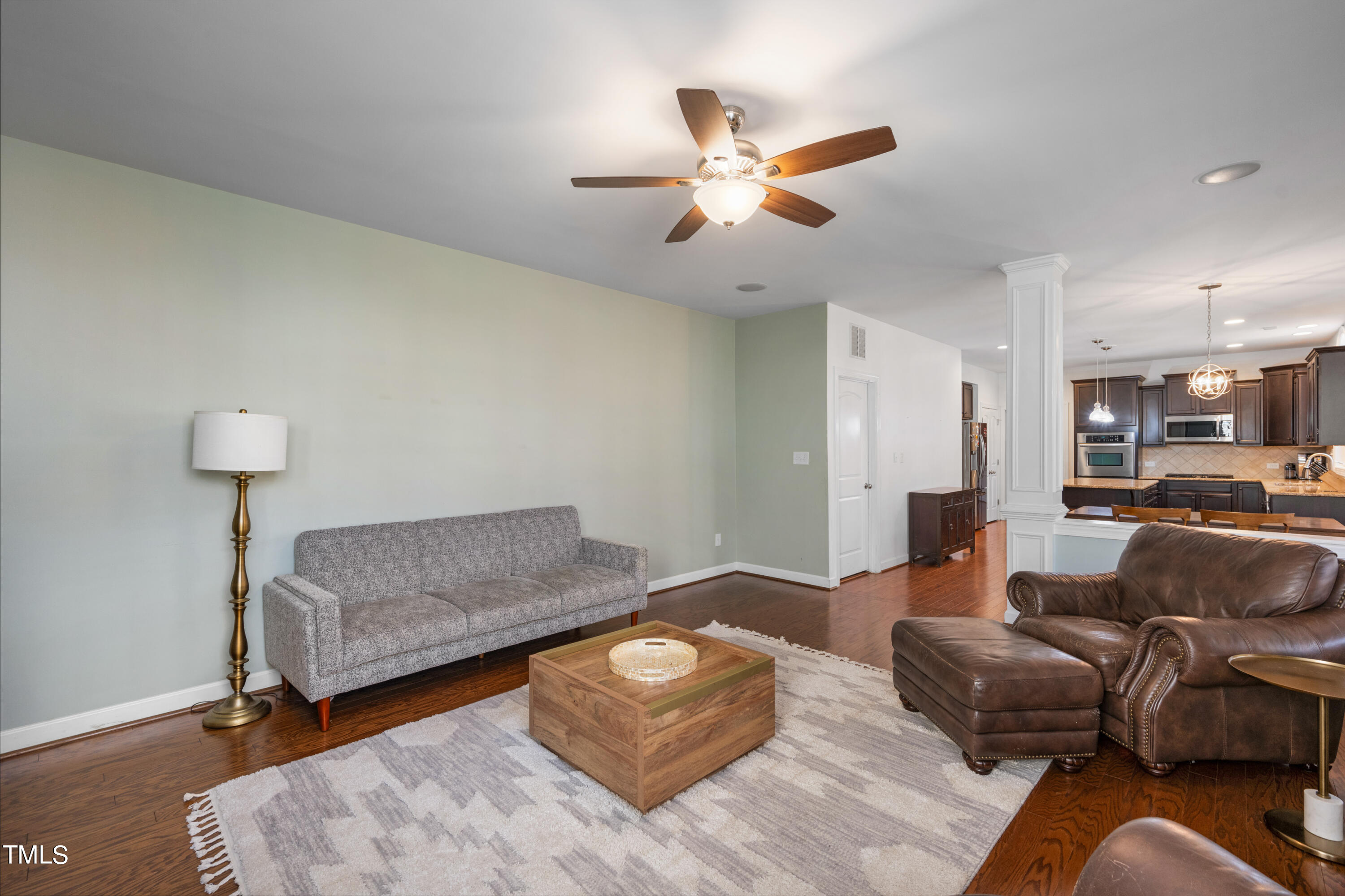 3020 Red Grape Drive Raleigh, NC 27607 - Photo 21 of 37 a living room with furniture and a lamp