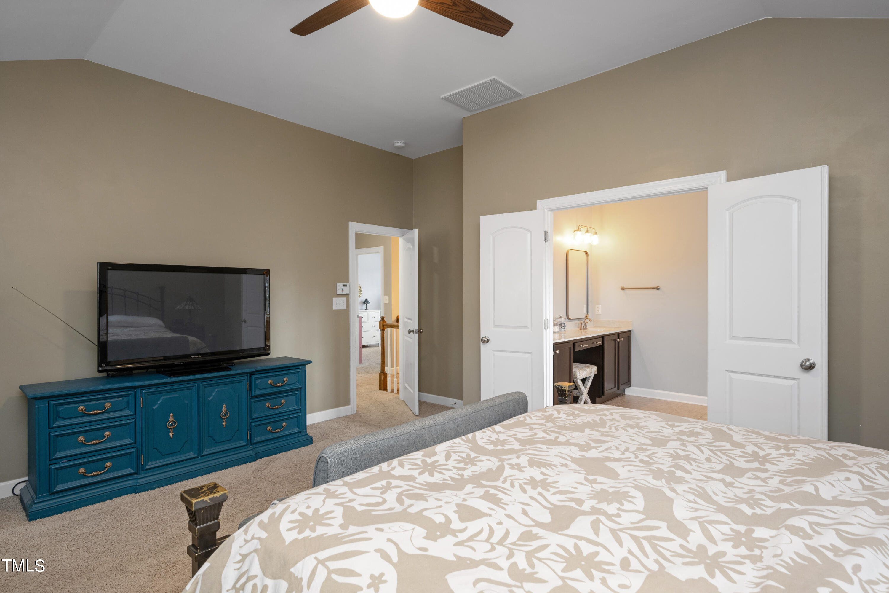 3020 Red Grape Drive Raleigh, NC 27607 - Photo 26 of 37 a bedroom with a bed and a flat screen tv