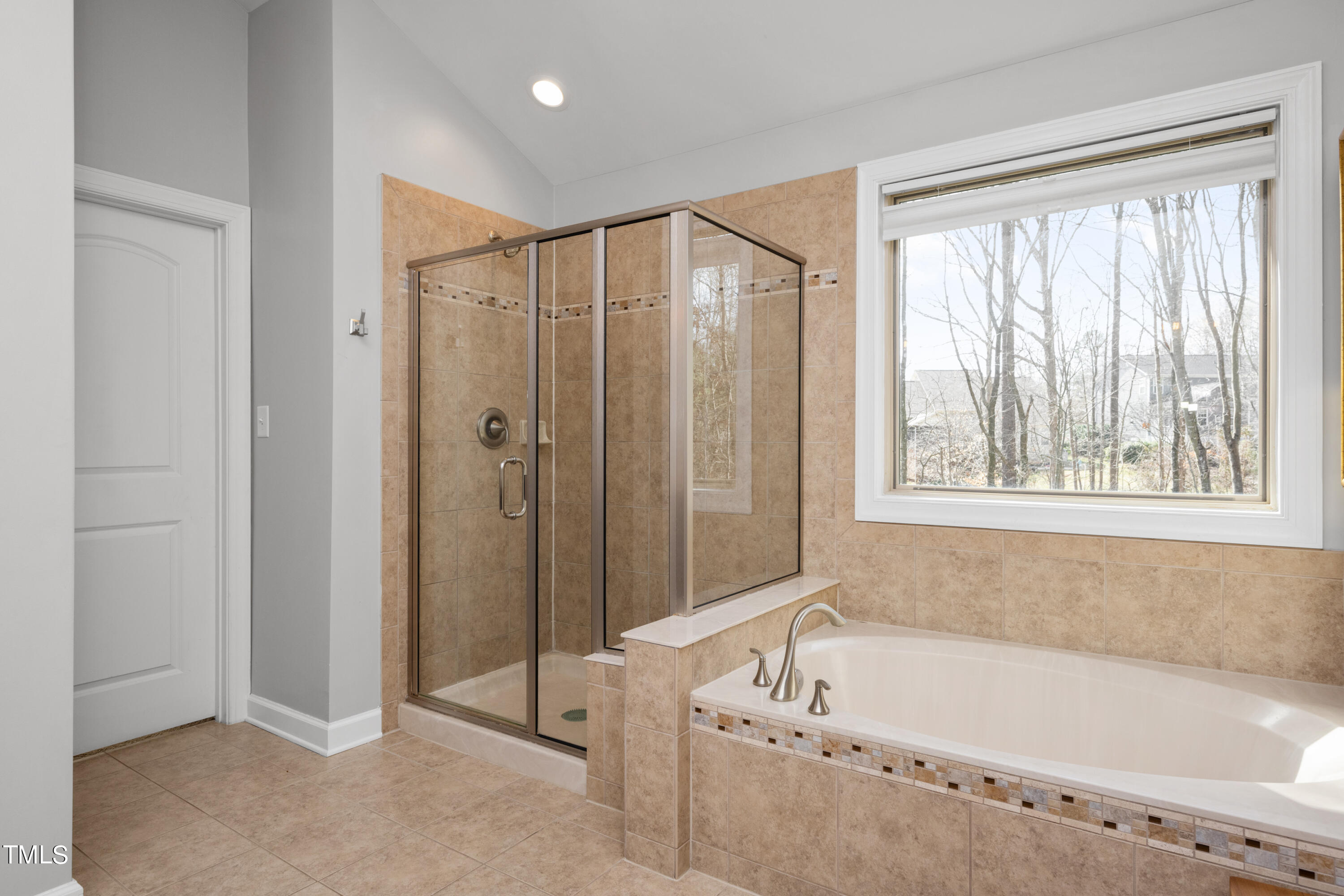3020 Red Grape Drive Raleigh, NC 27607 - Photo 28 of 37 a bathroom with a bathtub and a shower