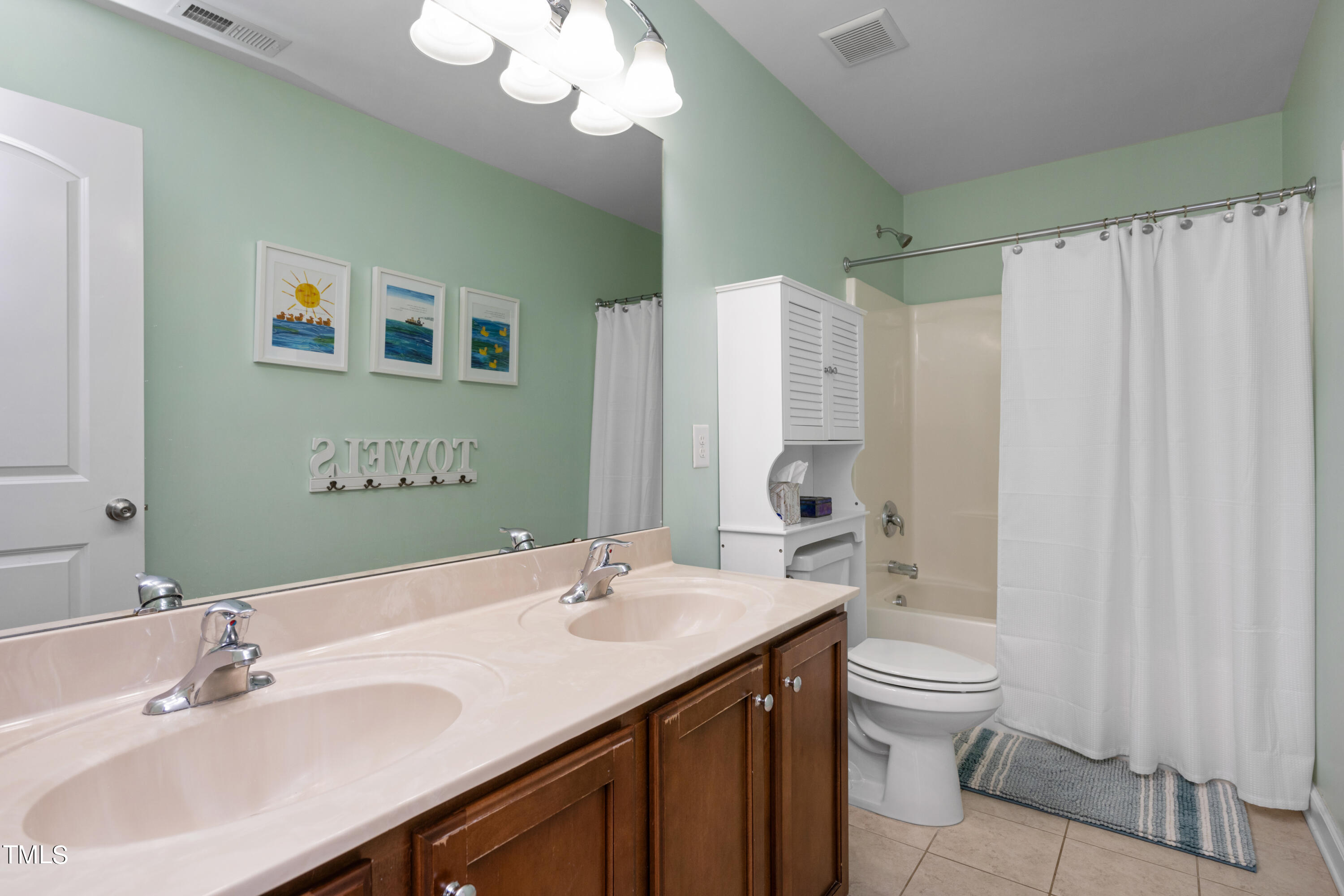 3020 Red Grape Drive Raleigh, NC 27607 - Photo 30 of 37 a bathroom with a double vanity sink mirror and toilet