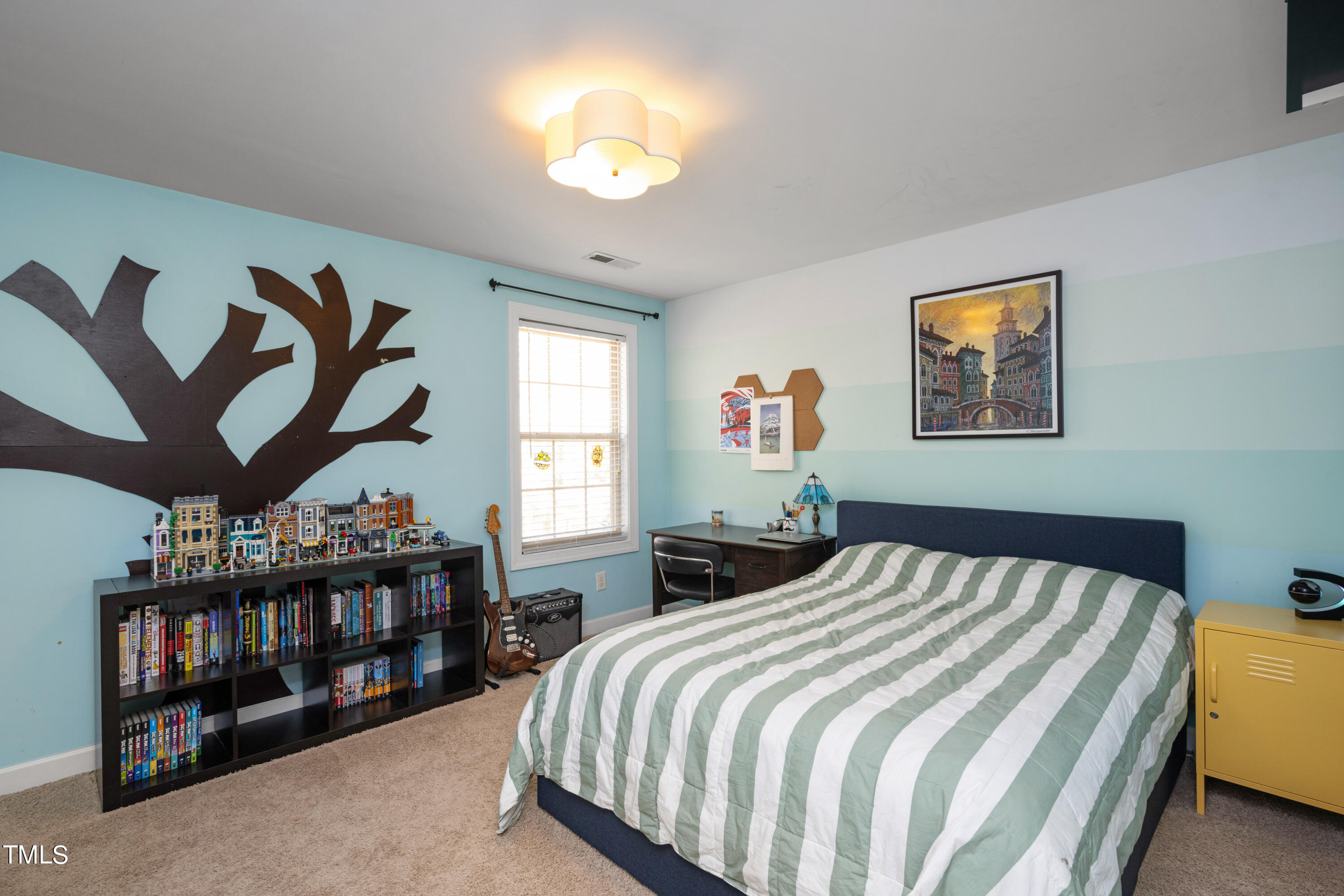 3020 Red Grape Drive Raleigh, NC 27607 - Photo 33 of 37 a bed sitting in a bedroom next to a window