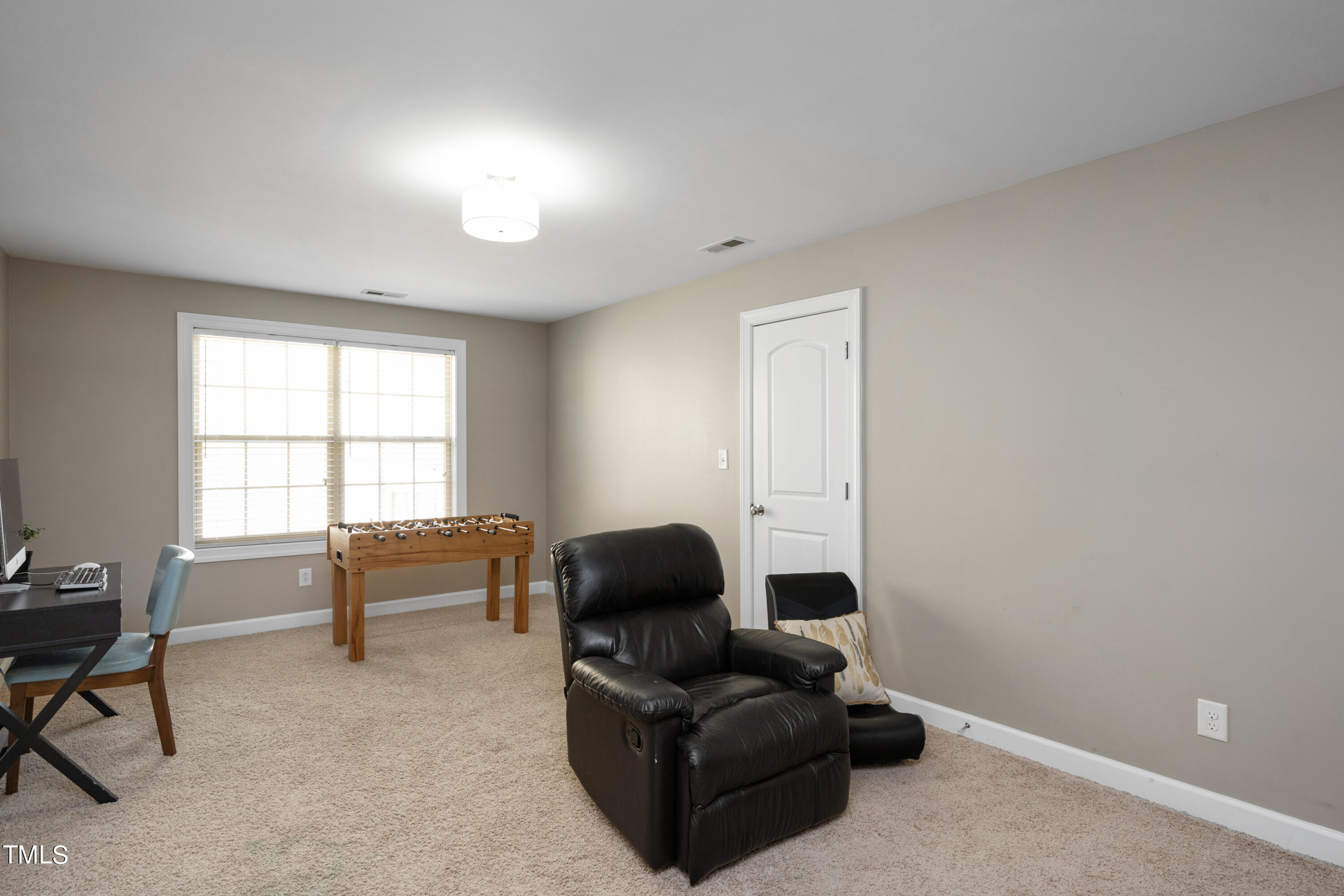 3020 Red Grape Drive Raleigh, NC 27607 - Photo 34 of 37 a living room with furniture and a window