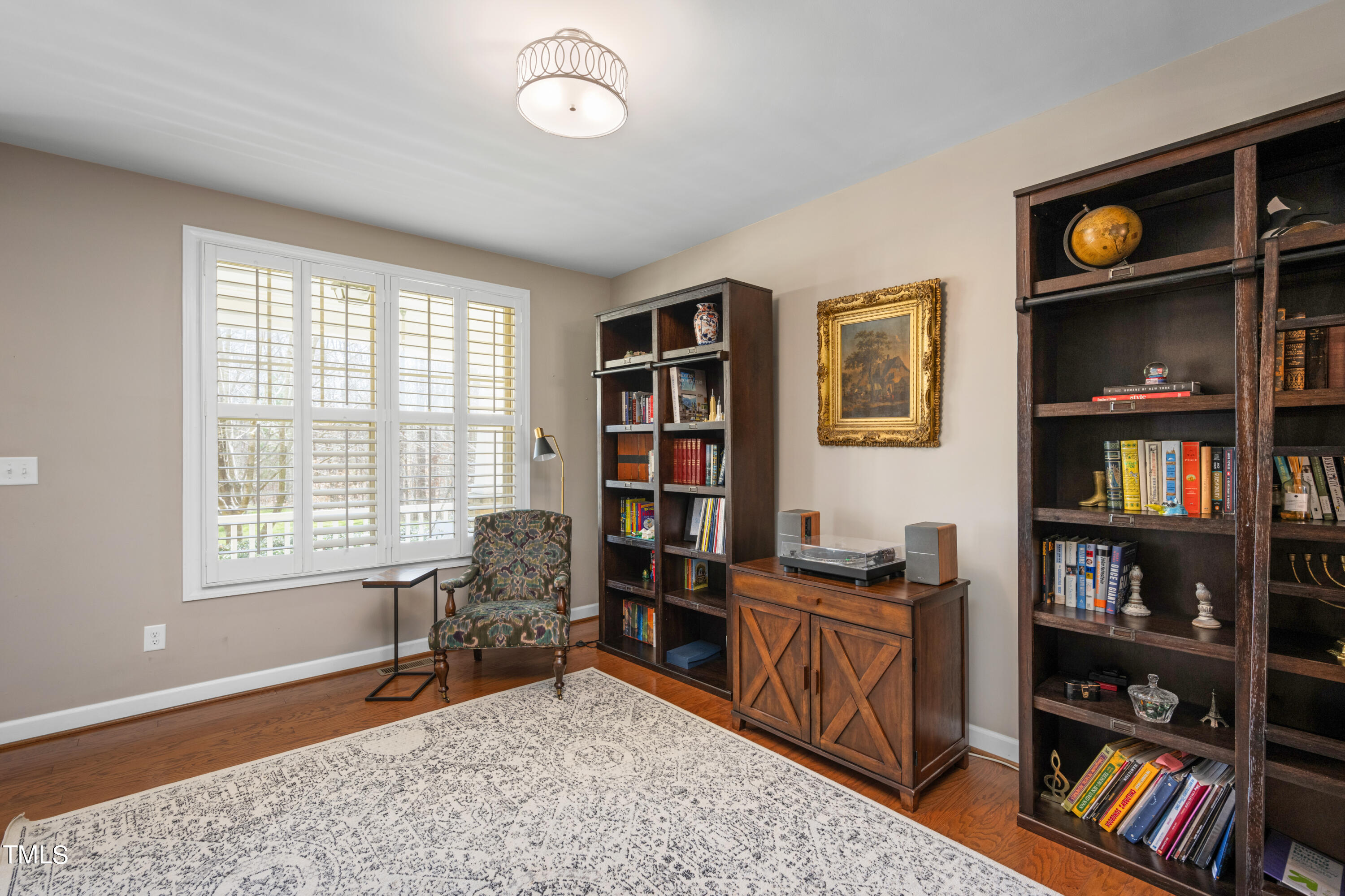 3020 Red Grape Drive Raleigh, NC 27607 - Photo 10 of 37 a workspace with furniture window and book shelf
