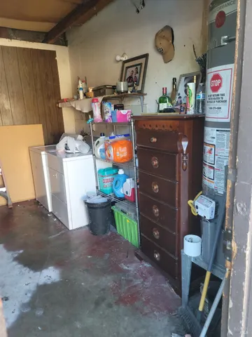 a view of a porch with a floor to ceiling window next to a yard