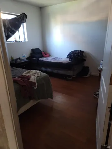 a bathroom with a toilet sink and shower curtain