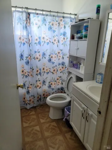 a bedroom with bed and window