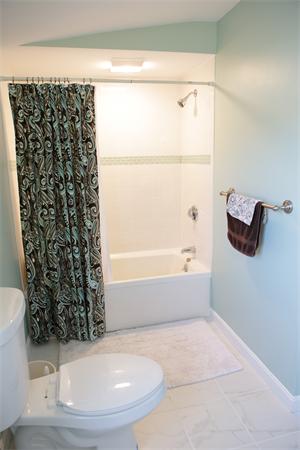 1 Arnold Road Peabody, MA 01960 - Photo 17 of 21 a bathroom with a bathtub and a shower