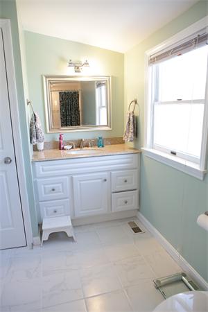 1 Arnold Road Peabody, MA 01960 - Photo 18 of 21 a bathroom with a double vanity sink toilet mirror and window