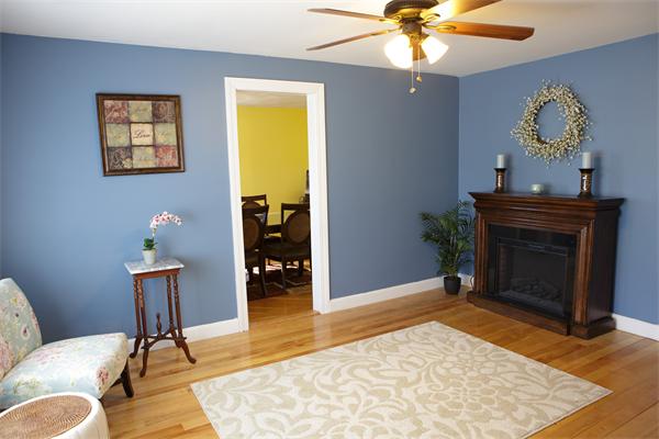 1 Arnold Road Peabody, MA 01960 - Photo 7 of 21 a living room with furniture and a fireplace