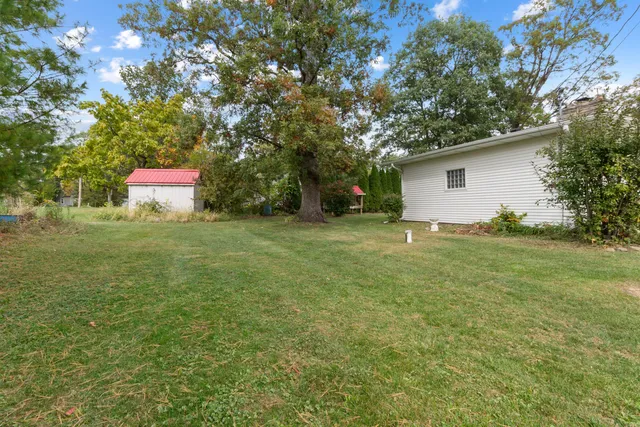 a backyard of a house with lots of green space
