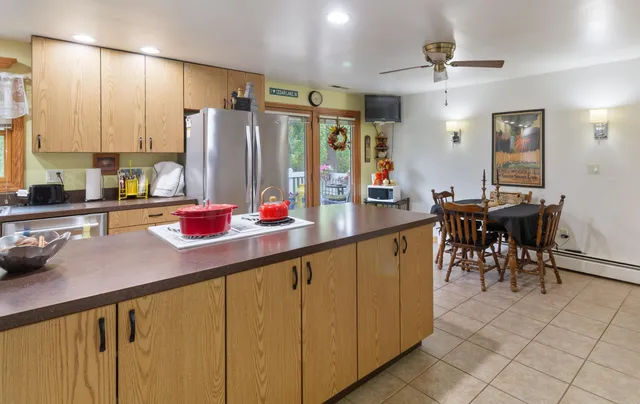 a kitchen with stainless steel appliances granite countertop sink cabinets and window