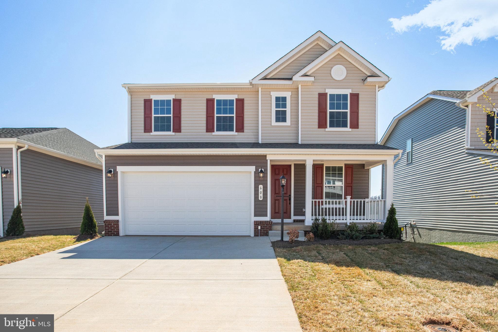 608 Clover Lane Orange, VA 22960 - Photo 1 of 38 a front view of a house with a yard and garage