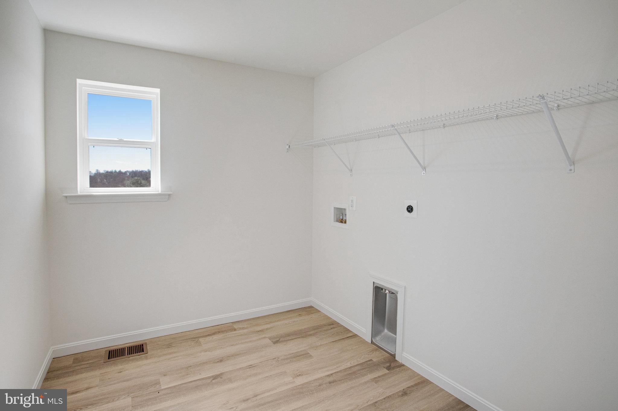 608 Clover Lane Orange, VA 22960 - Photo 16 of 38 a view of an empty room with wooden floor