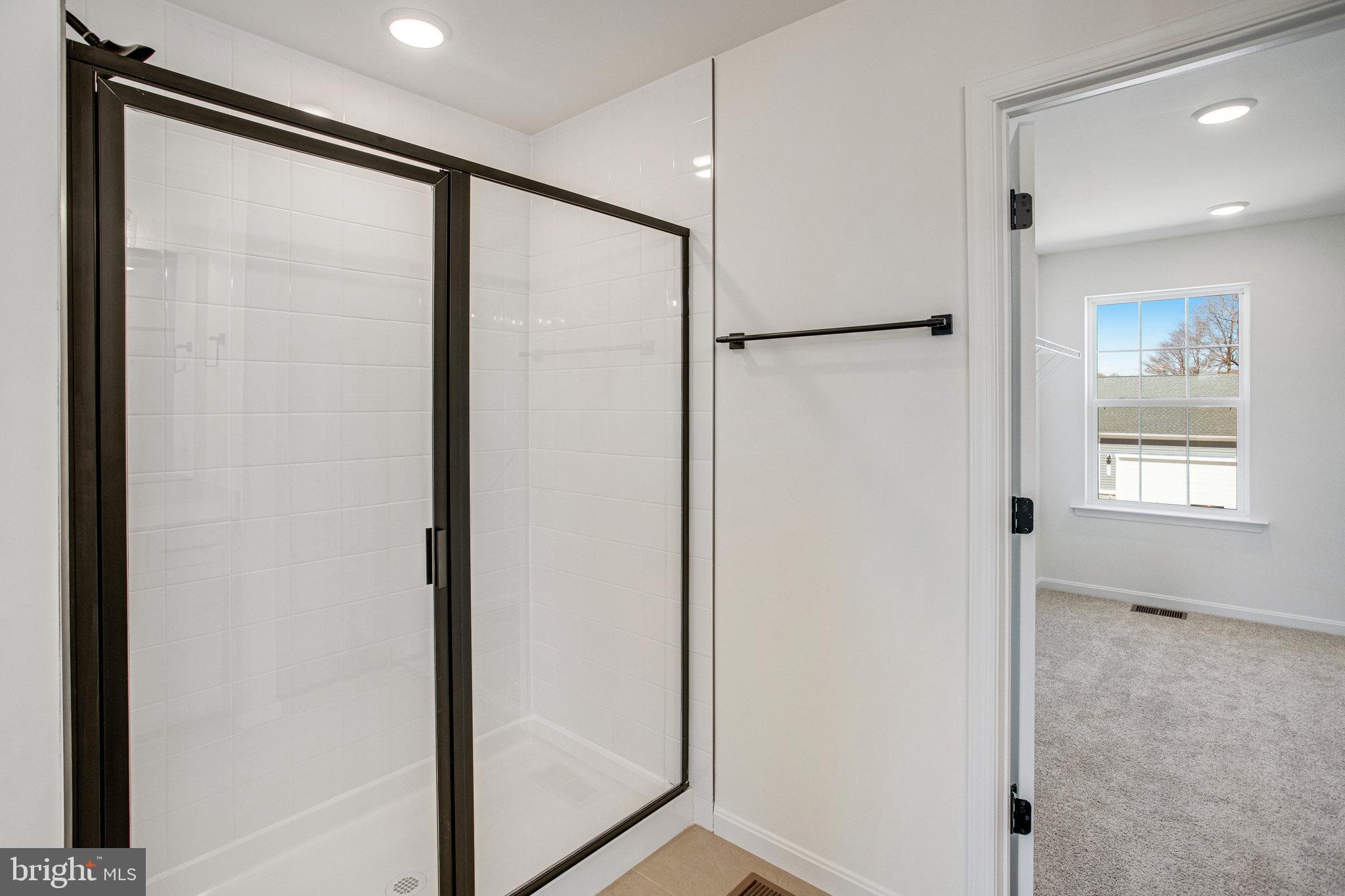 608 Clover Lane Orange, VA 22960 - Photo 20 of 38 a bathroom with a glass shower door