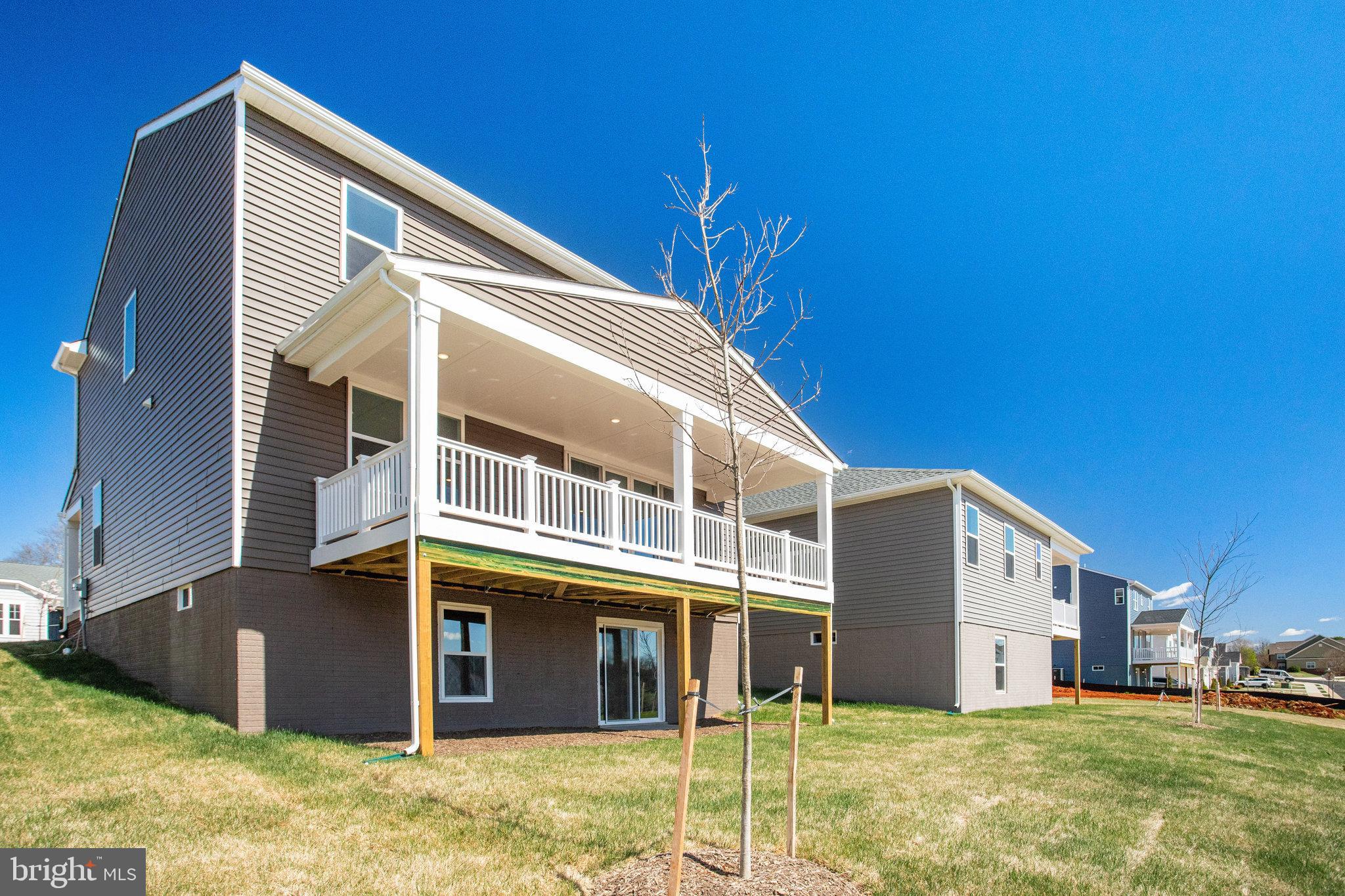 608 Clover Lane Orange, VA 22960 - Photo 26 of 38 a front view of a house with a yard