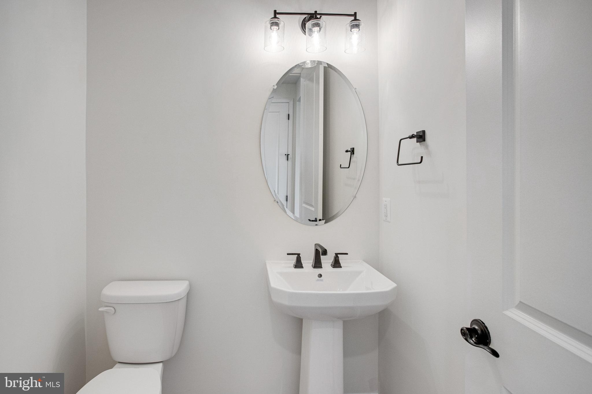 608 Clover Lane Orange, VA 22960 - Photo 29 of 38 a bathroom with a toilet sink and mirror