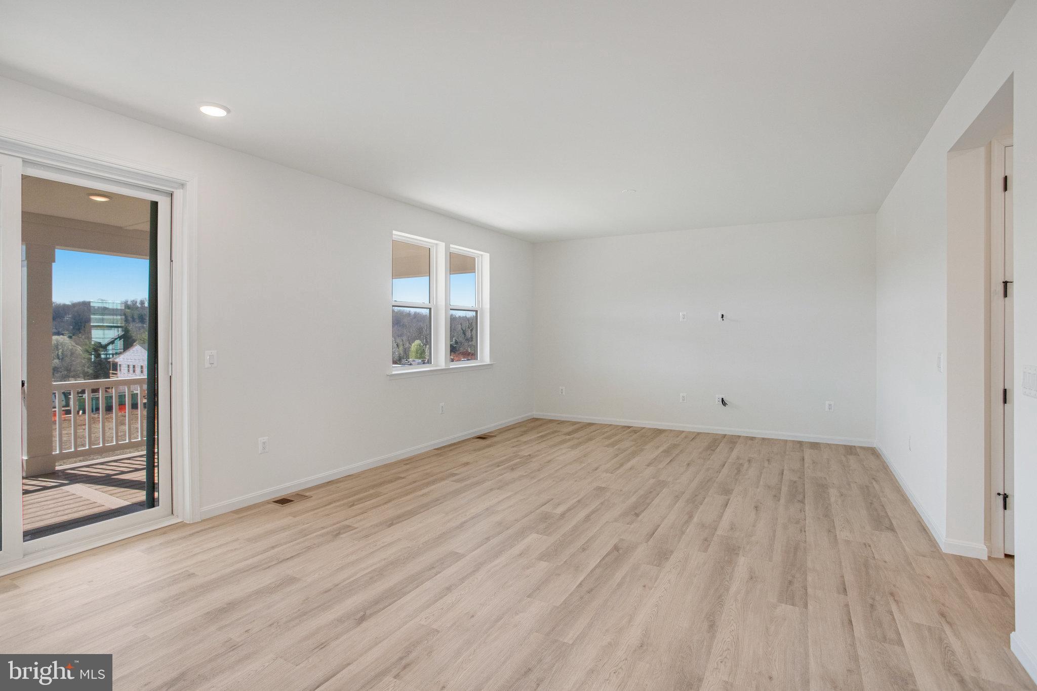 608 Clover Lane Orange, VA 22960 - Photo 30 of 38 an empty room with wooden floor and windows