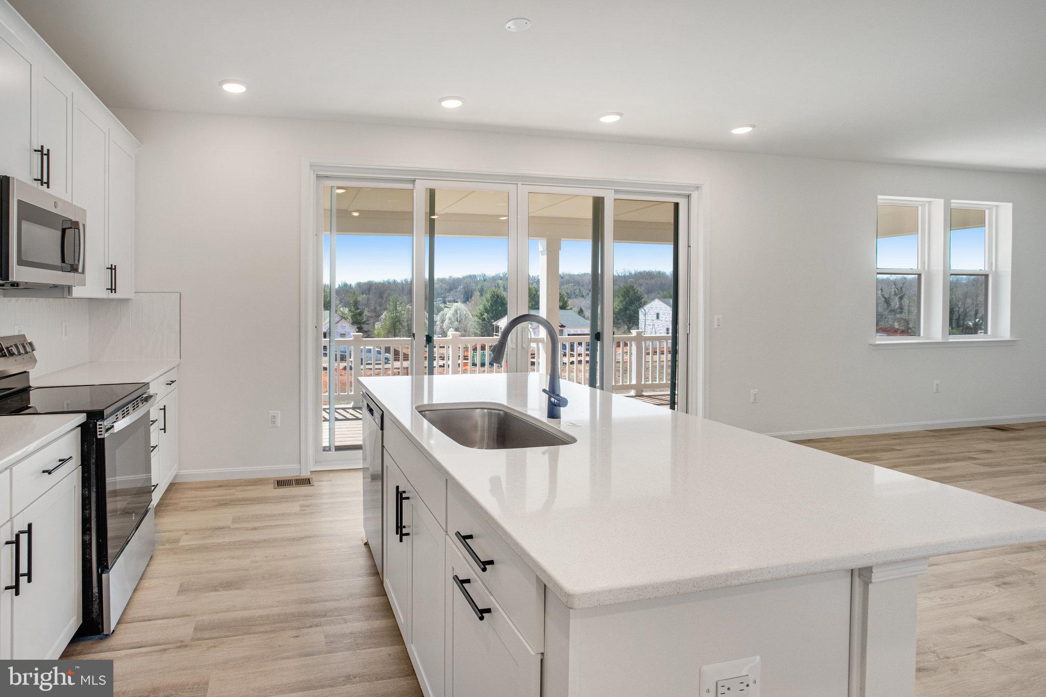 608 Clover Lane Orange, VA 22960 - Photo 35 of 38 a kitchen with stainless steel appliances a sink and cabinets